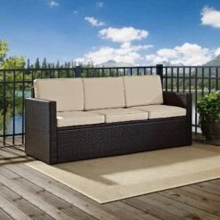 Palm Harbor Outdoor Wicker Sofa In Brown With Sand Cushions - Crosley -Sunnydaze Decor Store GUEST 88c4f0eb 67e9 45d8 965a 78f4e075bc83