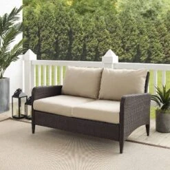 Kiawah Outdoor Wicker Loveseat Beige - Crosley -Sunnydaze Decor Store GUEST 9fb8fd04 bcc0 4d69 9f29 fe9264050a41